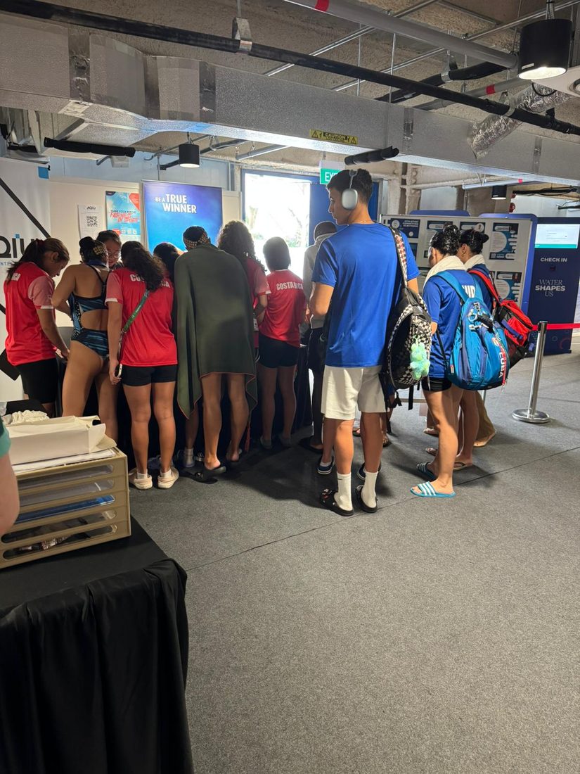 Athletes waiting at the Passionate Nails booth in the athletes' lounge