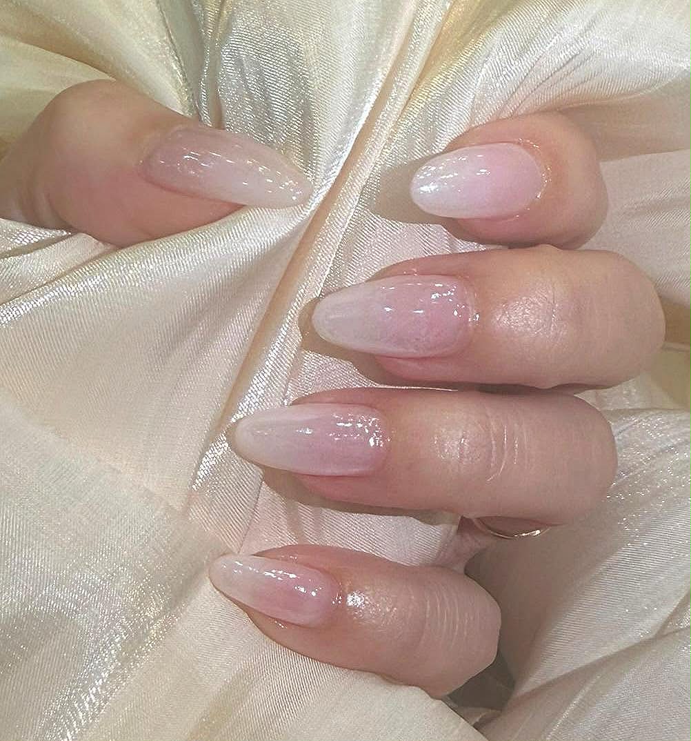 Glazed milky-pink almond nails by Passionate Nails