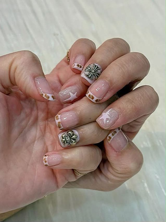 Leopard-print French nails with silver charm art